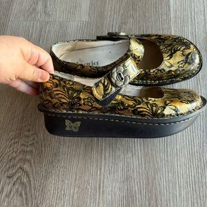 Alegria Paloma Black Gold Floral Mary Jane Clogs